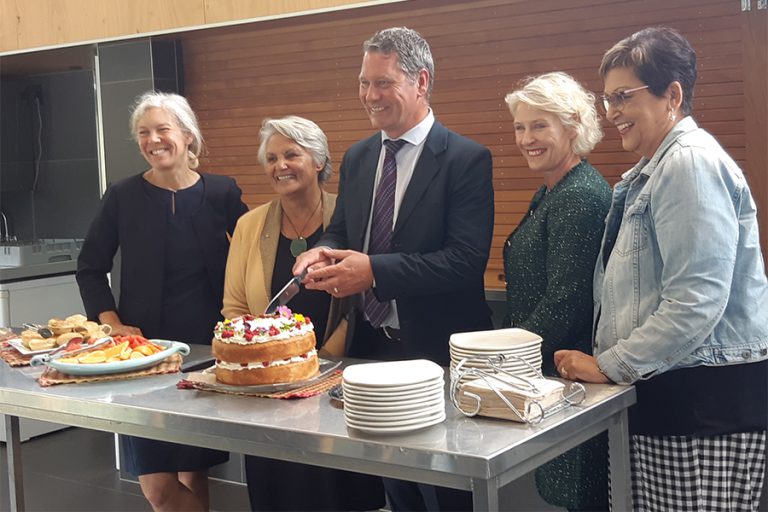 Cutting a cake.